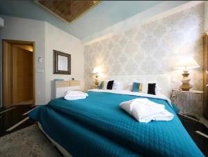 Postel nebo postele na pokoji v ubytování Residence Antiqua Rooms