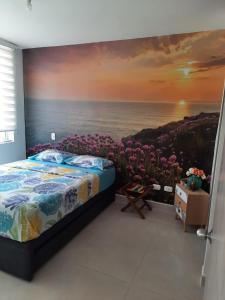 a bedroom with a painting of the ocean at Ricaurte vía a Girardot -Peñazul Aldea in Ricaurte
