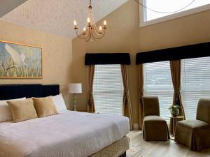 a bedroom with a large bed and a large window at Hotel Frankfort & Restaurant in Frankfort