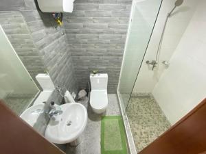 A bathroom at Urban One Apartments, Kumasi - Adinkrahene