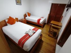 En eller flere senger på et rom på Hostal Turistico ILLAPA CUSCO 119