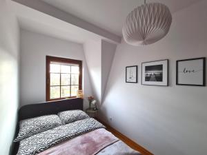 Łóżko lub łóżka w pokoju w obiekcie Przystań 21