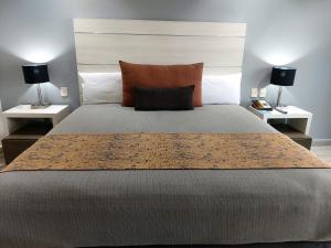 Llit o llits en una habitació de Real Inn Perinorte