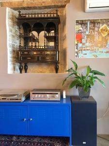 a blue cabinet with a plant on top of it at Birdhouse in Motovun