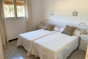 Giường trong phòng chung tại Casa rural Can Pep de Sa Barda - Entre viñedos - Formentera Natural