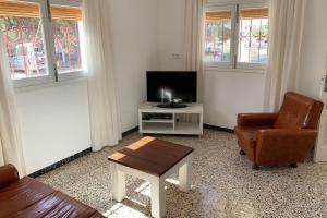 Televízia a/alebo spoločenská miestnosť v ubytovaní Casa rural Can Pep de Sa Barda - Entre viñedos - Formentera Natural