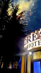 a sign for a drury hotel at night at Hotel Dream in Stara Zagora