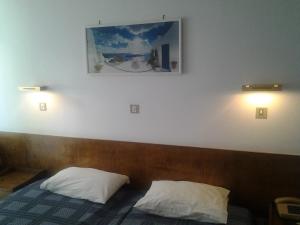 Postel nebo postele na pokoji v ubytování Oasis Hotel