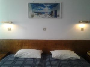 Postel nebo postele na pokoji v ubytování Oasis Hotel
