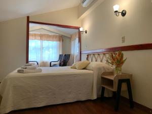 Una cama o camas en una habitación de Gran Hotel Bahia
