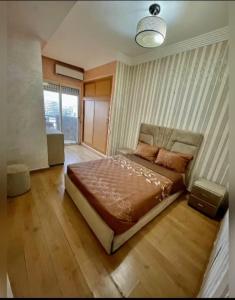 a bedroom with a large bed in a room at A lovely apartment with a nice view in Casablanca