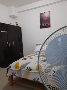 a bedroom with a bed with a bed frame at Cozy Whole Apartment in Lima