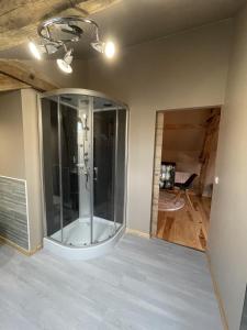 a large glass shower in a room with a ceiling at Domaine de la Grenadille in Bourdalat +14 photos