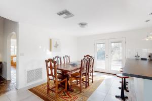 a kitchen and dining room with a table and chairs at Lazy C Ranch in Tucson