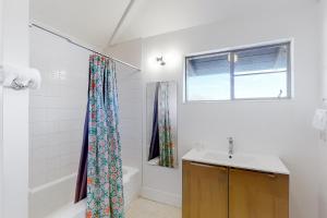 a bathroom with a sink and a shower curtain at Lazy C Ranch in Tucson