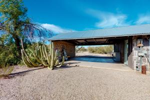 a building with a cactus in front of it at Lazy C Ranch in Tucson