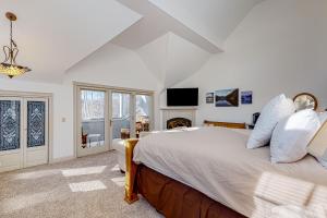 a bedroom with a large bed and a fireplace at The Rest in Jackson