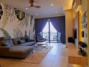 a living room with a couch and a table at NEW Condo Atlantis Melaka Town @ Memories in Melaka