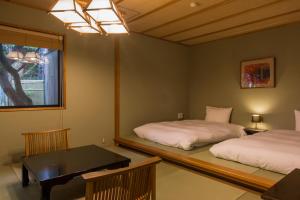 Letto o letti in una camera di Toushinan Komeya