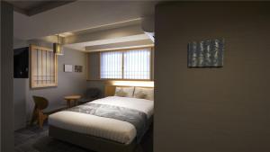KYOTO GION HOTEL客房内的一张或多张床位