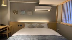 KYOTO GION HOTEL客房内的一张或多张床位