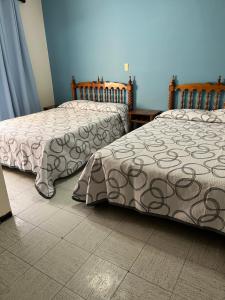 Postel nebo postele na pokoji v ubytování Hotel Paris + 21 fotografií