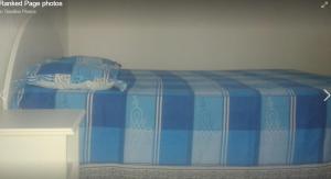 a blue and white bed in a room at Chez Bablou in Grand-Baie +6 photos