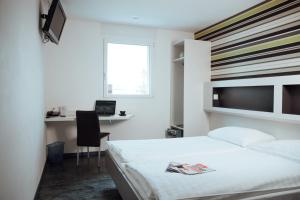 Ein Bett oder Betten in einem Zimmer der Unterkunft My Hotel