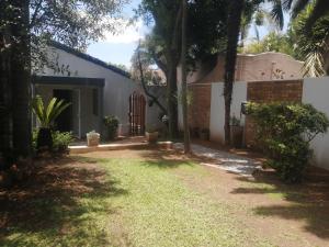 a house with a gate and a yard at 394OnEmus in Pretoria