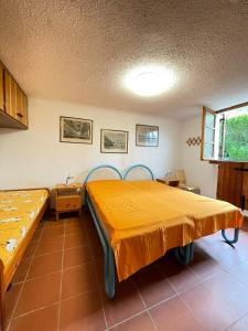 Ένα ή περισσότερα κρεβάτια σε δωμάτιο στο VILLA CA' SILVA - WALTERIGATO Apartments SOLO PER FAMIGLIE
