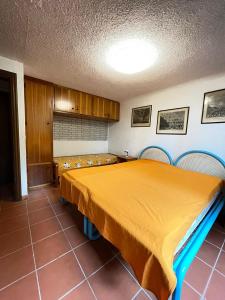 Ένα ή περισσότερα κρεβάτια σε δωμάτιο στο VILLA CA' SILVA - WALTERIGATO Apartments SOLO PER FAMIGLIE