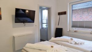 Fotografie z fotogalerie ubytování Pension Likedeeler Doppelzimmer William Kidd v destinaci Borkum