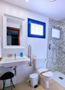 a bathroom with a toilet and a sink and a shower at Chinijo Beach in Caleta de Sebo