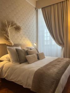 Tempat tidur dalam kamar di Chambres d'hôtes Relais Mira Peis