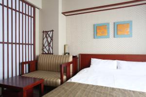 Voodi või voodid majutusasutuse Kadensho, Arashiyama Onsen, Kyoto - Kyoritsu Resort toas