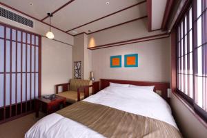 Voodi või voodid majutusasutuse Kadensho, Arashiyama Onsen, Kyoto - Kyoritsu Resort toas