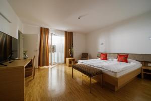 TV o dispositivi per l'intrattenimento presso Hotel Garni Toscanina - Adults Only