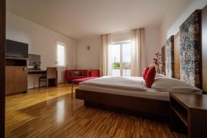 Letto o letti in una camera di Hotel Garni Toscanina - Adults Only