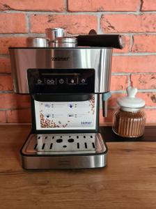 a coffee maker sitting on top of a table at Apartament Wróblewski in Gdańsk