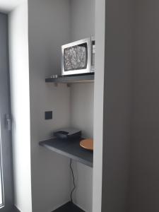 Μια τηλεόραση ή/και κέντρο ψυχαγωγίας στο Apartament przy jeziorze Czorsztynskim