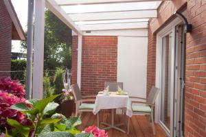 Ein Balkon oder eine Terrasse in der Unterkunft Hotel garni NordSeerose Greetsiel