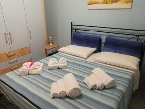 Кровать или кровати в номере Casa Pescoluse 50m dal Mare