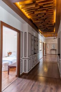 a large room with a bed and a large doorway at Bhola Bhawan Bed and Breakfast in Jaipur