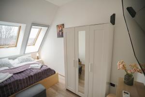 Posteľ alebo postele v izbe v ubytovaní Koffer Apartman