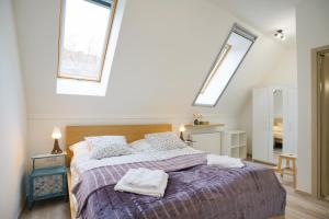 Posteľ alebo postele v izbe v ubytovaní Koffer Apartman