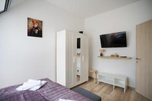 Posteľ alebo postele v izbe v ubytovaní Koffer Apartman