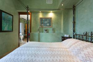 Posteľ alebo postele v izbe v ubytovaní The Trastevere Penthouse Experience