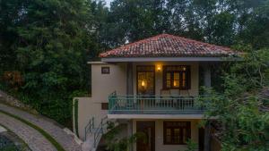 a house with a balcony on the side of it at Green Escape Unawatuna in Unawatuna