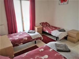 a room with two beds and a window at Gites de Bigorre in Cieutat +51 photos