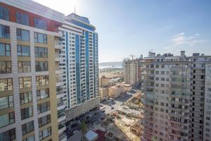 an aerial view of a city with tall buildings at Park Azure luxury in Baku